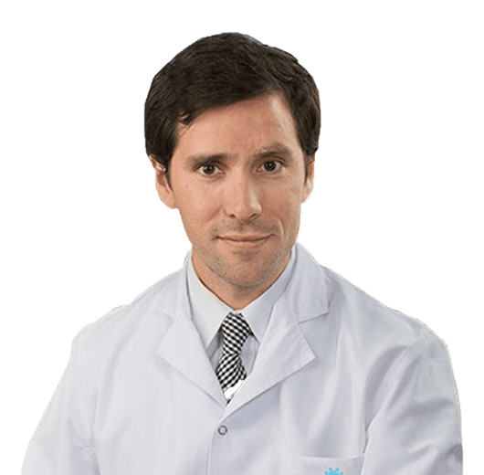 A man in white lab coat and tie.