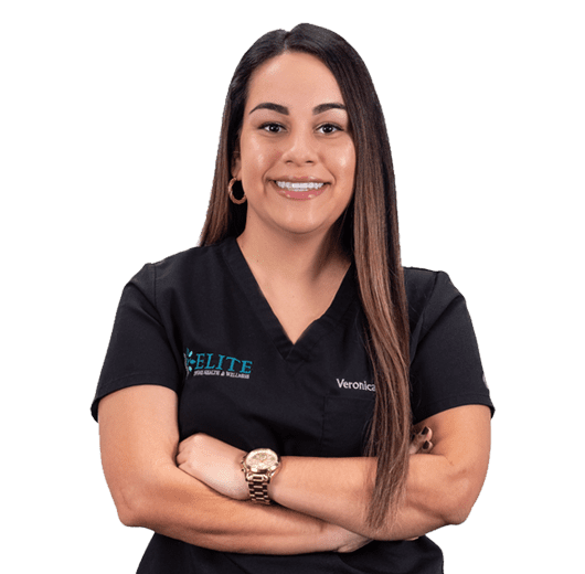 A woman with long hair and black shirt smiling.