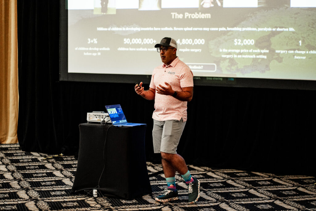 A man standing in front of a projector